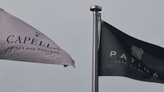 a black and white flag on a pole
