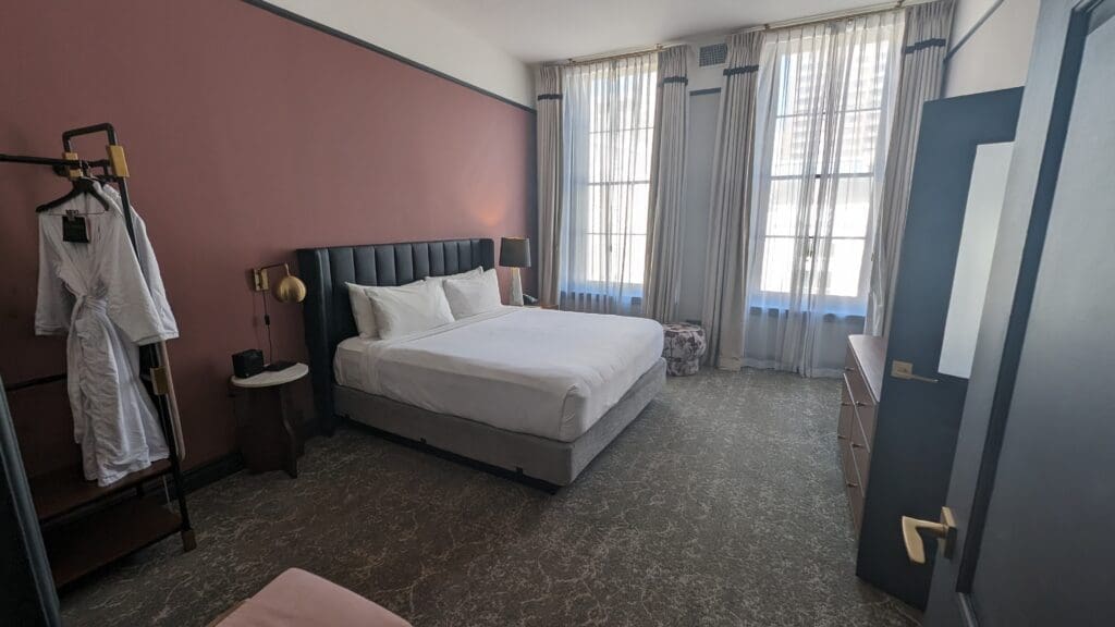 a bedroom with a bed and a dresser