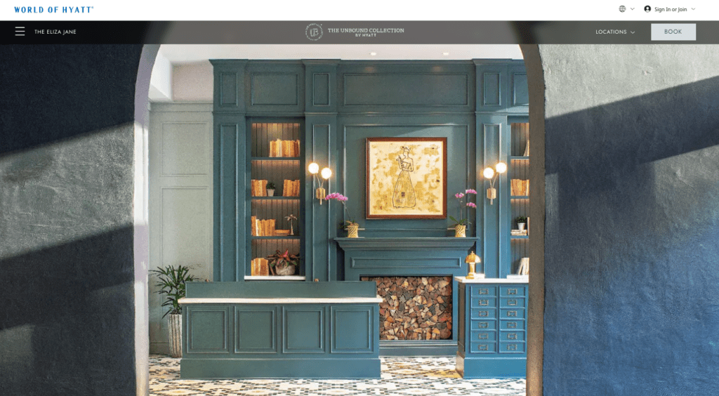 a screenshot of a room with a fireplace and a painting