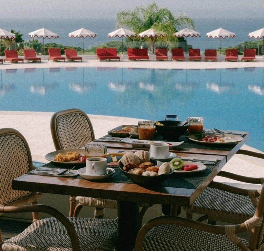 a table with food on it by a pool