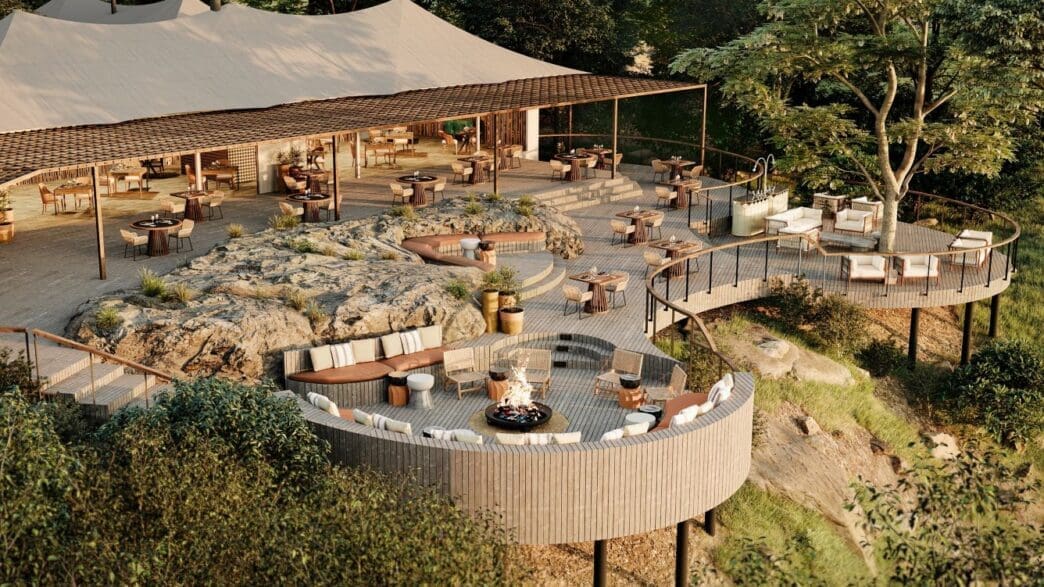 a large outdoor restaurant with a large tent and a large fire pit