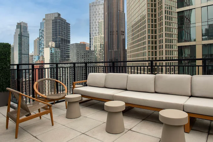 a couch and chairs on a rooftop