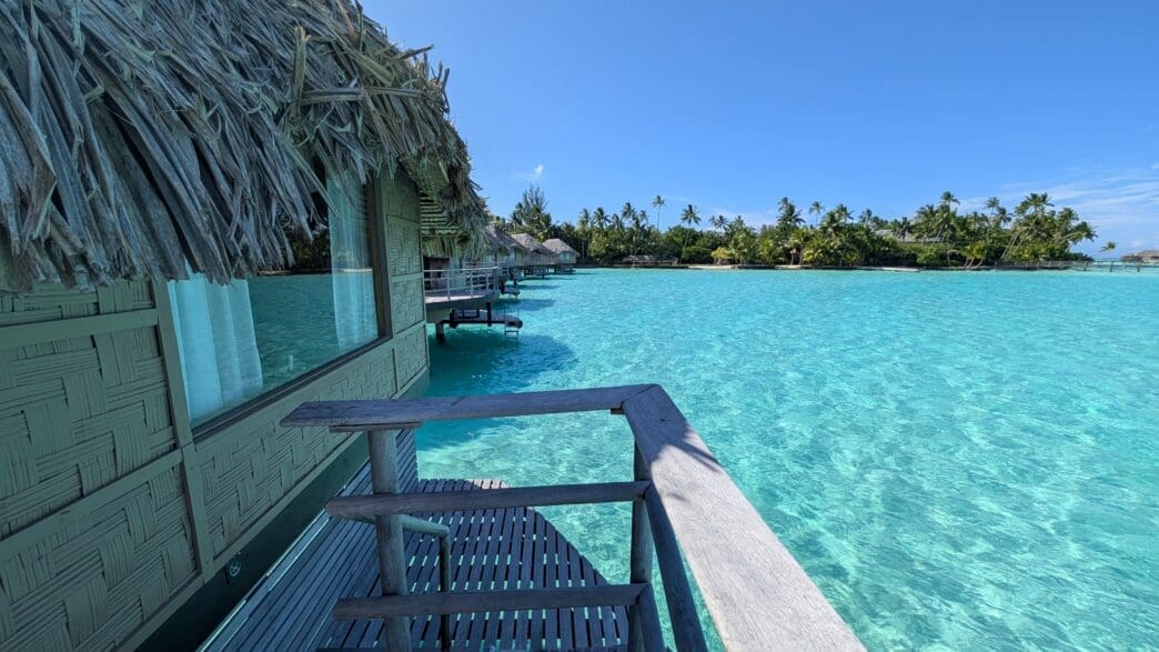a row of huts over water