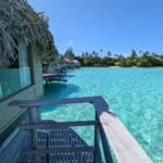 a row of huts over water