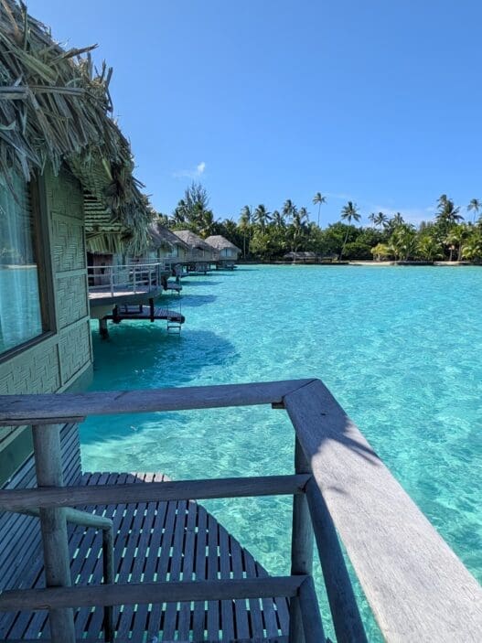 a row of huts over water