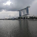 a body of water with buildings and trees