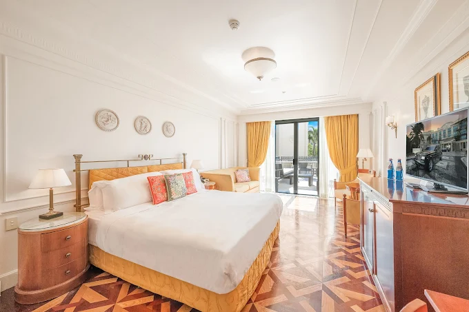 a room with a bed and a glass door