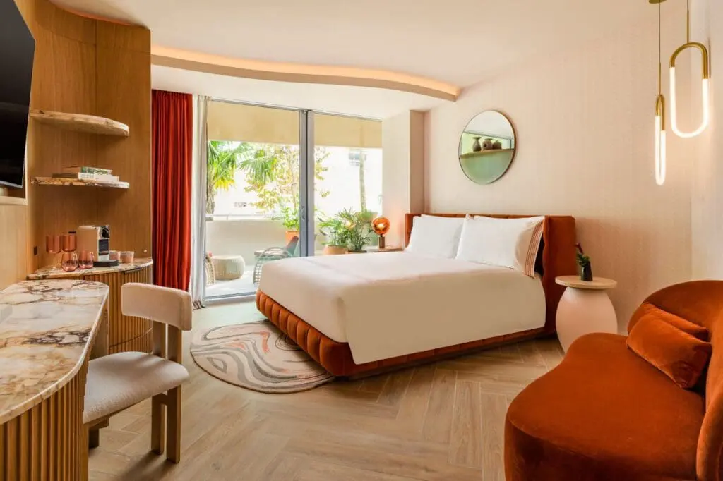 a bedroom with a bed and a mirror