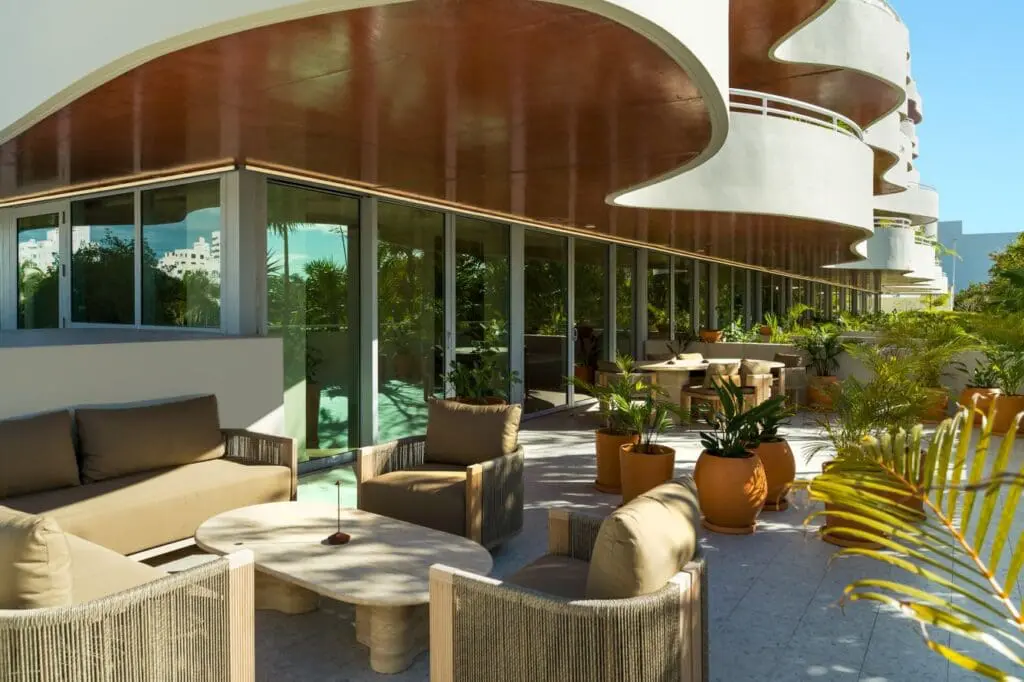 a patio with chairs and tables