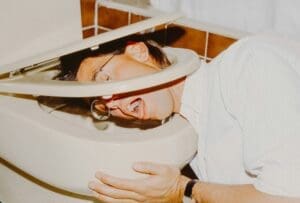 a man with his head in a toilet