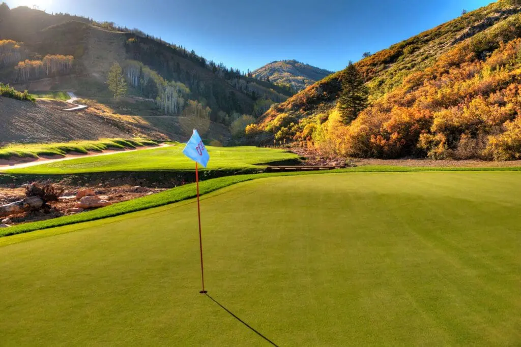 a golf course with a flag on the green