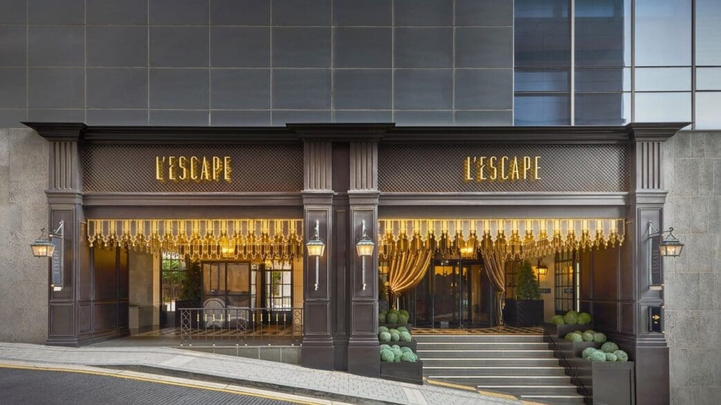 a building with a staircase and a sign