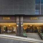 a building with a staircase and a sign