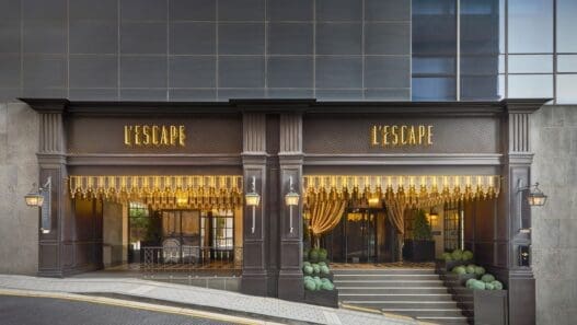 a building with a staircase and a sign