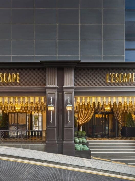 a building with a staircase and a sign