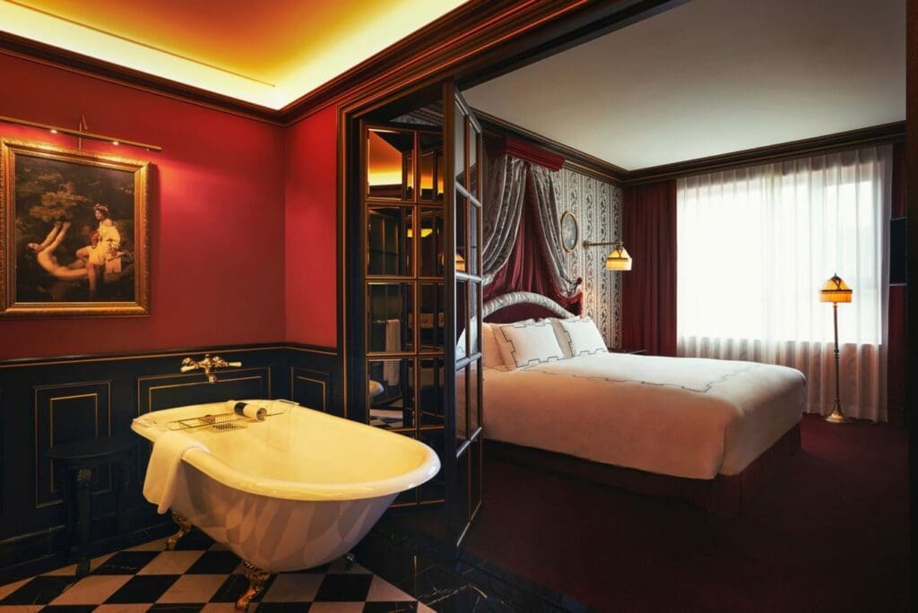 a room with a bed and a bathtub