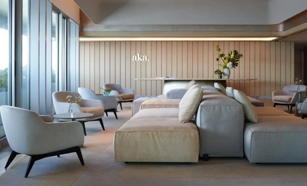 a large room with a large couch and chairs