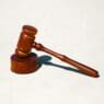 a wooden gavel on a stand
