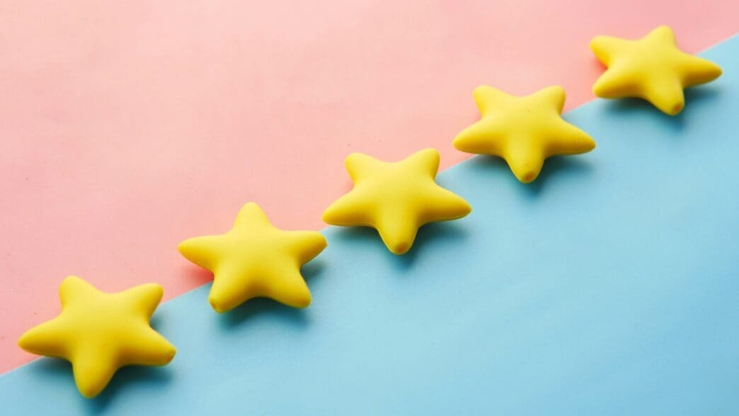 yellow stars on a blue and pink surface