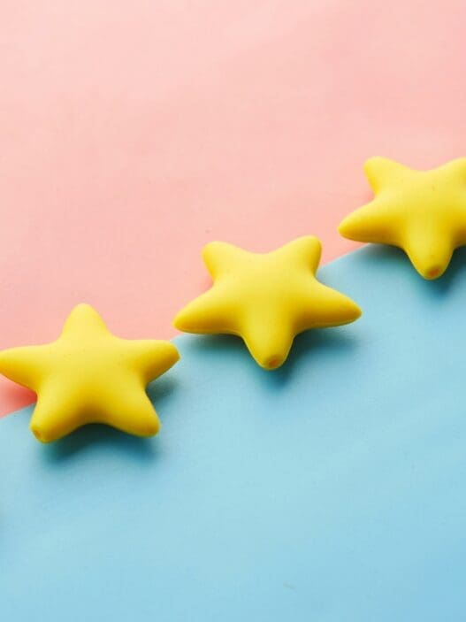 yellow stars on a blue and pink surface